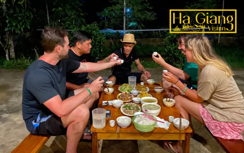 Travelers cherish Happy Water toasts as part of Ha Giang adventure.