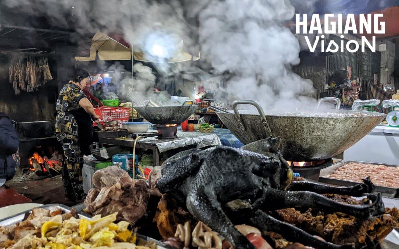The indoor area of Meo Vac Market highlights textiles and food.