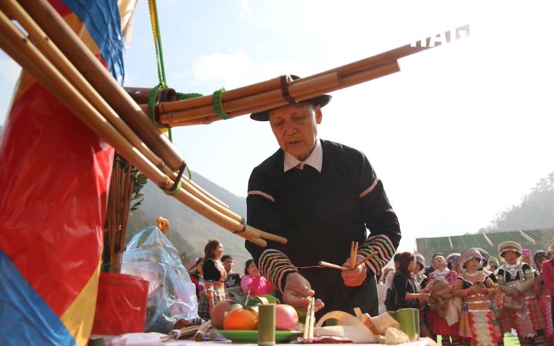 The Gau Tao festival begins with prayers, offerings, and ceremonial pole raising.