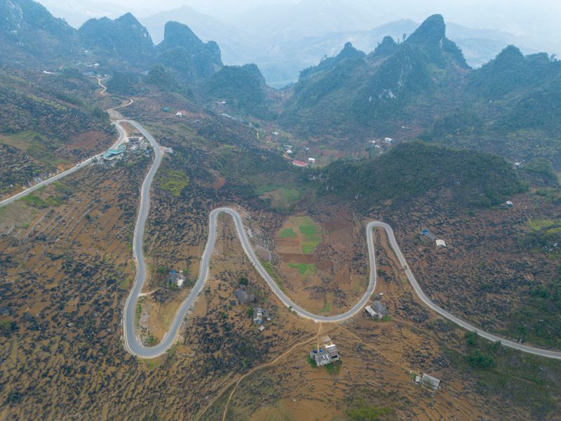 Road winding across the karst plateau on the Ha Giang Loop in autumn